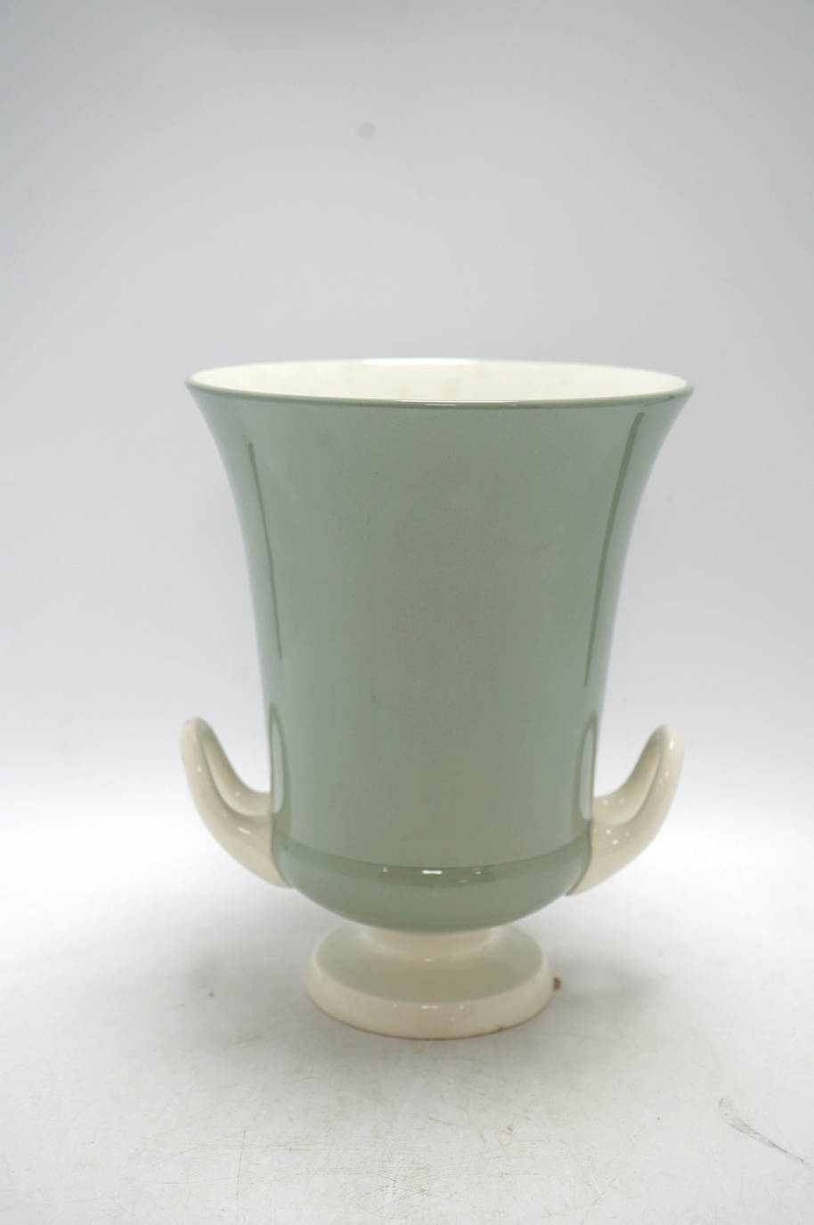 Keith Murray, a Wedgwood celadon glazed two handled vase, 25.5cm. Condition - good